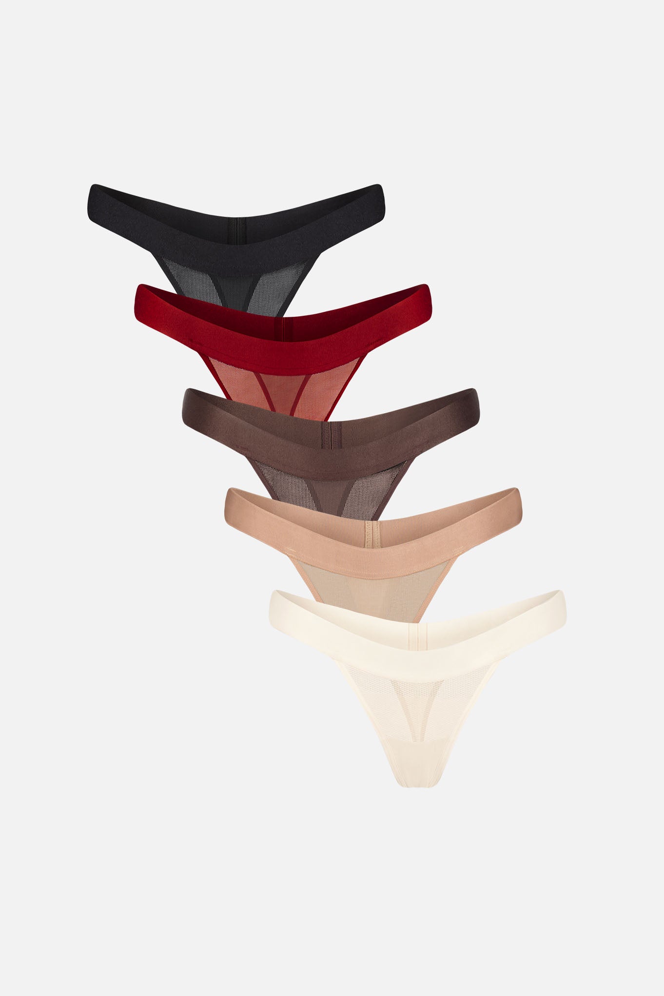 Five pairs of sheer thongs in different colors are stacked vertically on a light gray background. The colors are black, dark red, brown, beige, and off-white.