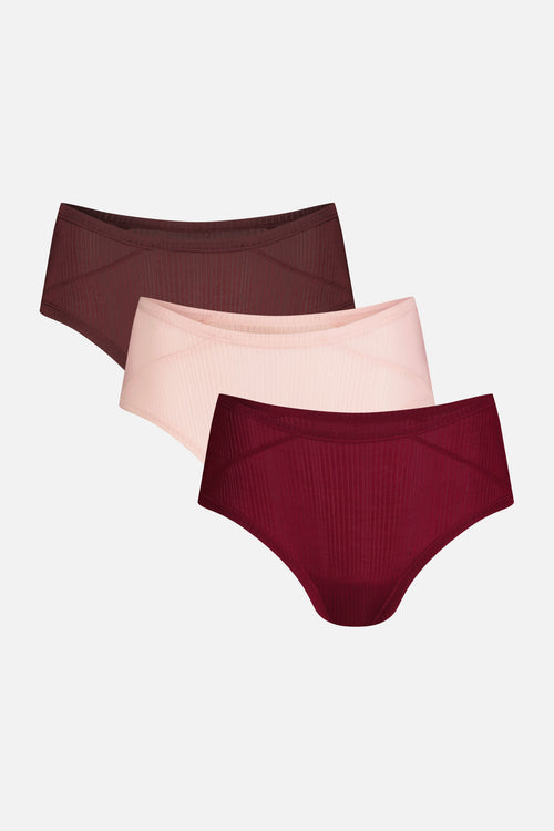Three pairs of ribbed high-waisted underwear in dark burgundy, light blush pink, and deep wine red, arranged in a staggered stack on a light gray background.