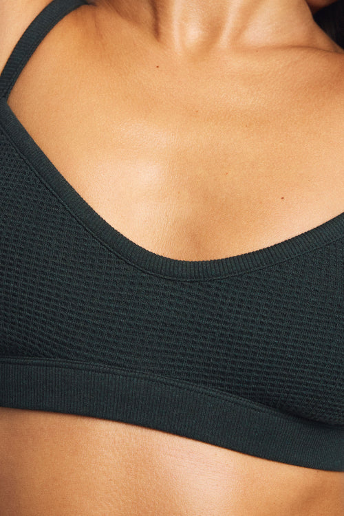 Close-up of cypress waffle-knit bralette scoop neckline and wide elastic underband