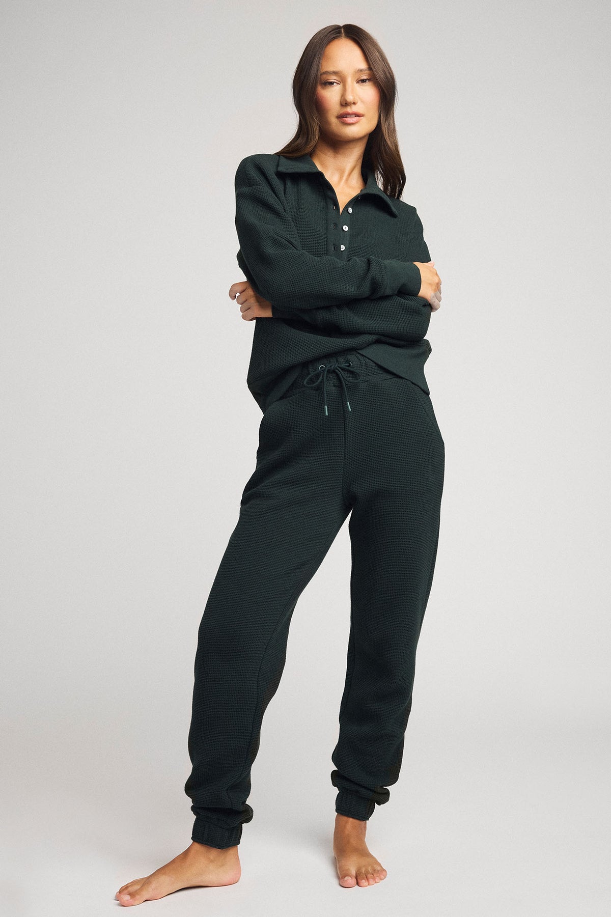 Dark teal waffle-knit pullover with henley collar and button placket, full body view