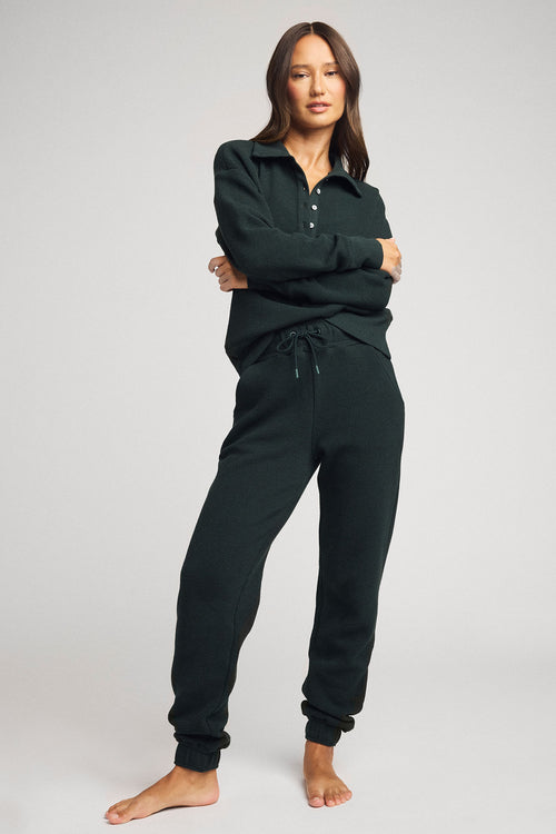 Dark teal waffle-knit pullover with henley collar and button placket, full body view