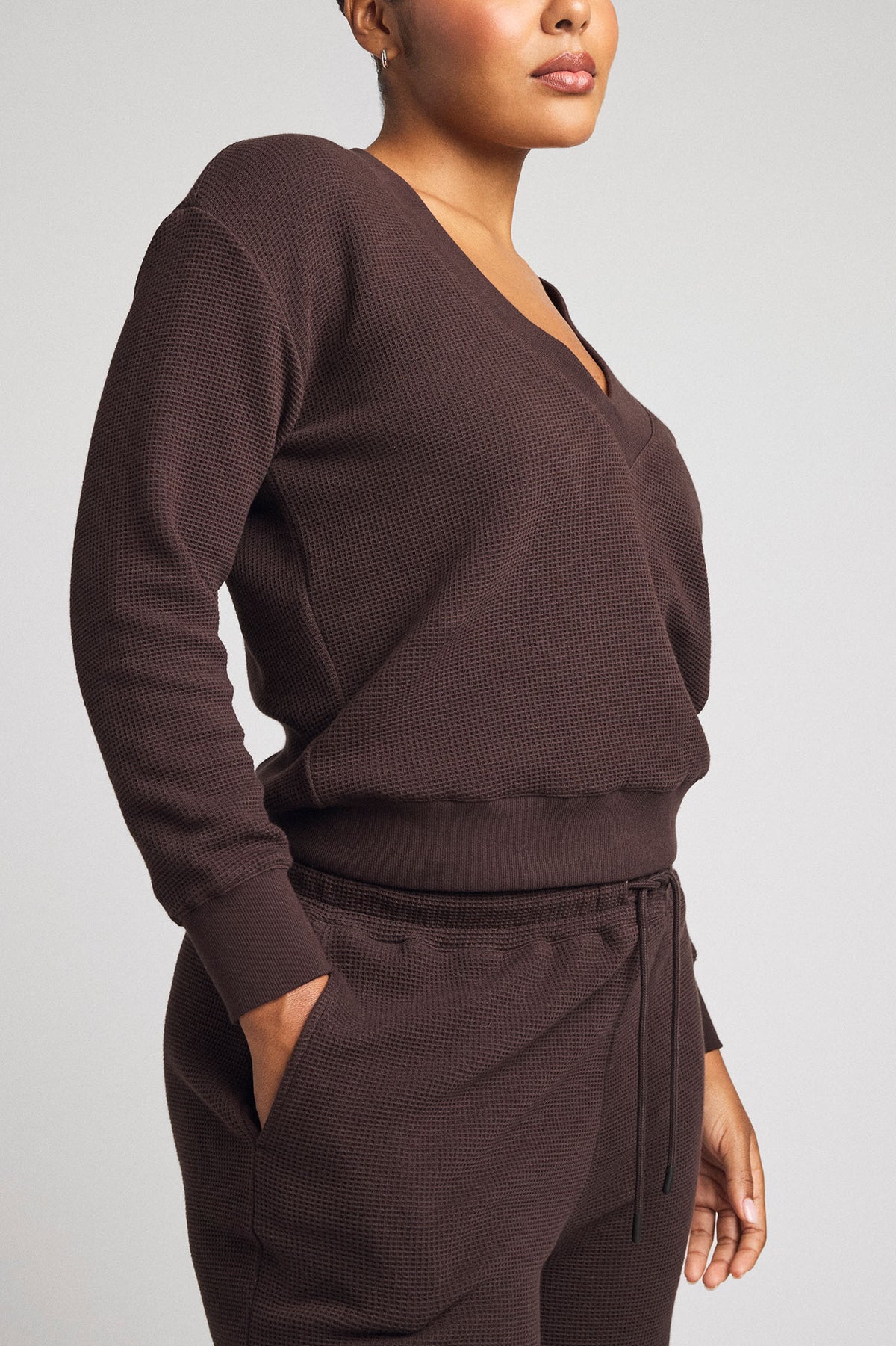Dark brown waffle-knit deep V long-sleeve top with drawstring jogger pants