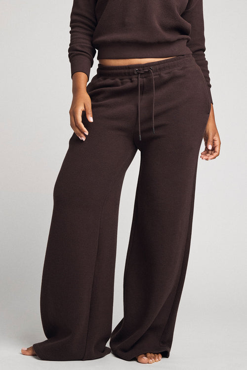 Women's waffle knit track pants in dark brown with drawstring waist and wide legs