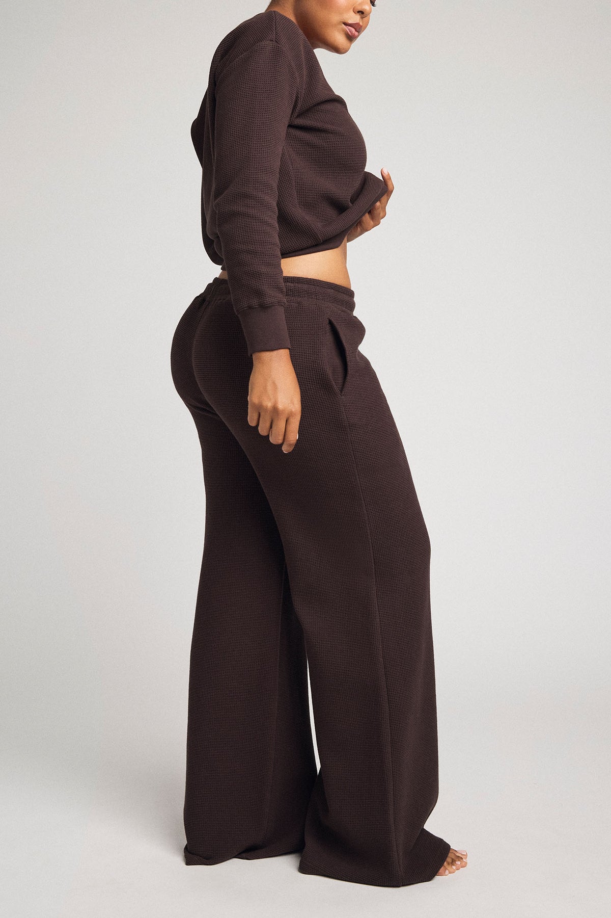 Waffle knit track pants in dark brown, wide-leg silhouette with adjustable drawstring