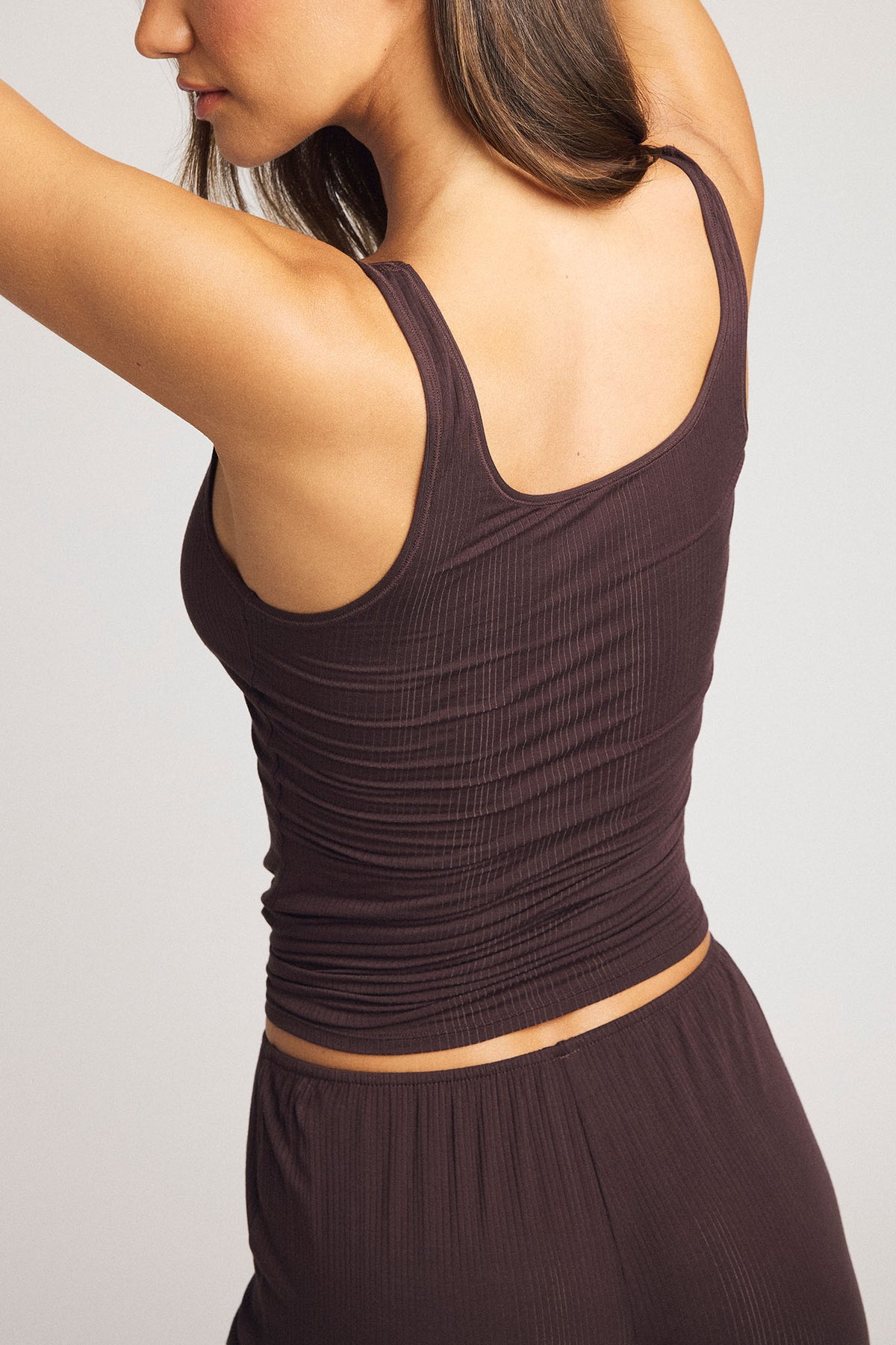 Women’s dark brown A-top with racerback and scooped back, ruched ribbed knit