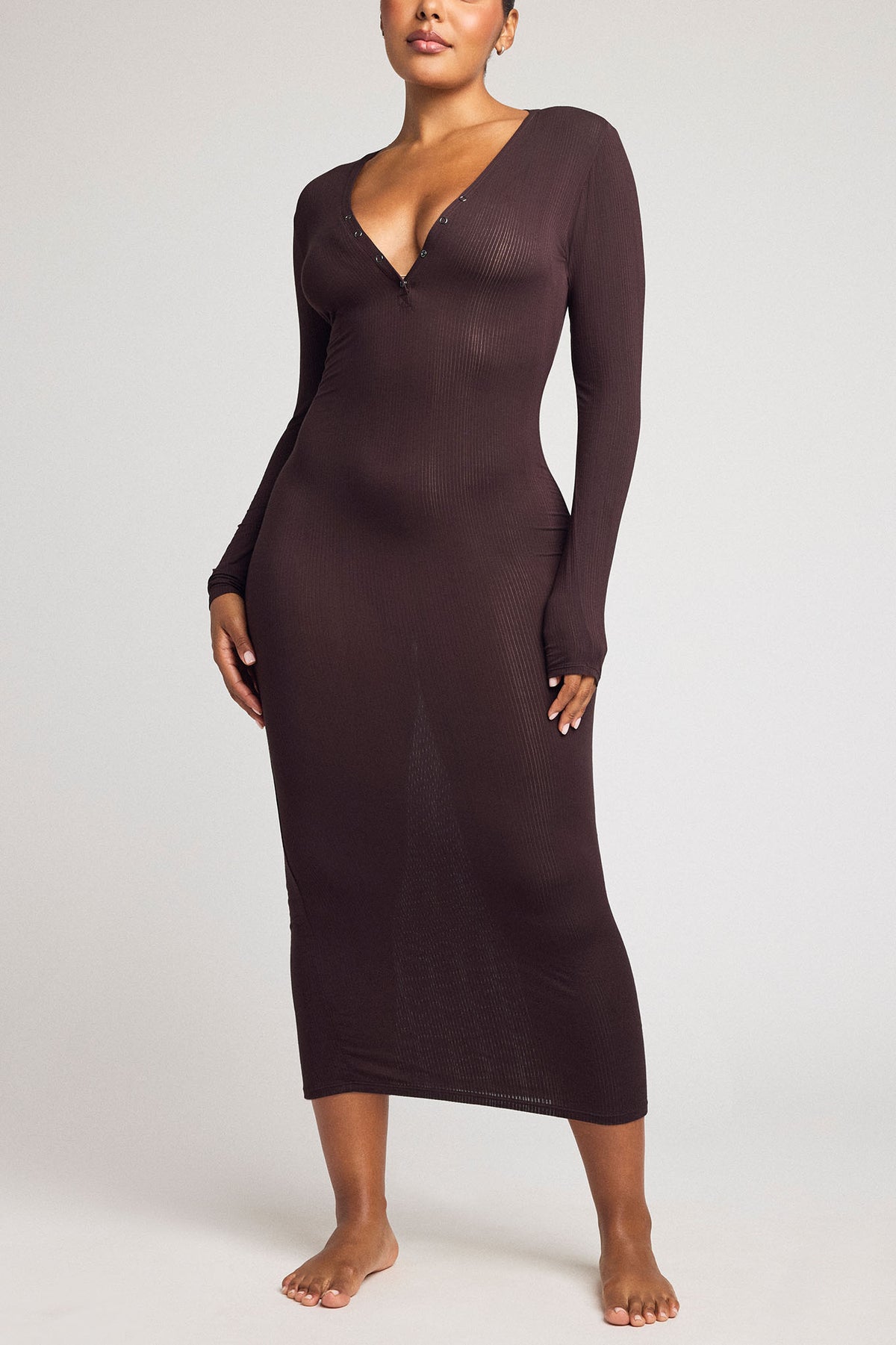 Dark brown long-sleeve henley midi dress with deep V neckline and button placket.