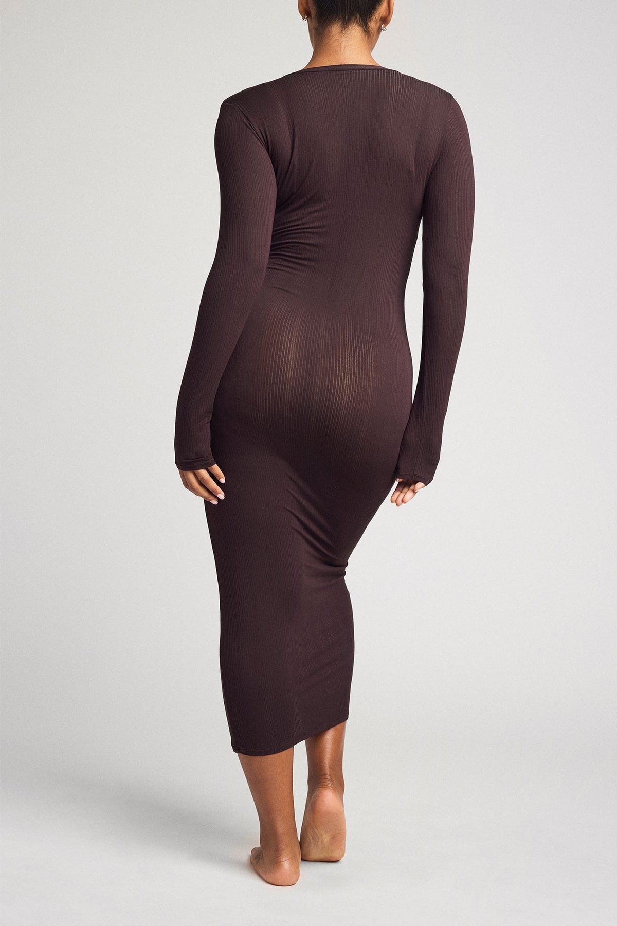 Dark brown henley midi dress, long sleeves, ruched back and fitted silhouette.