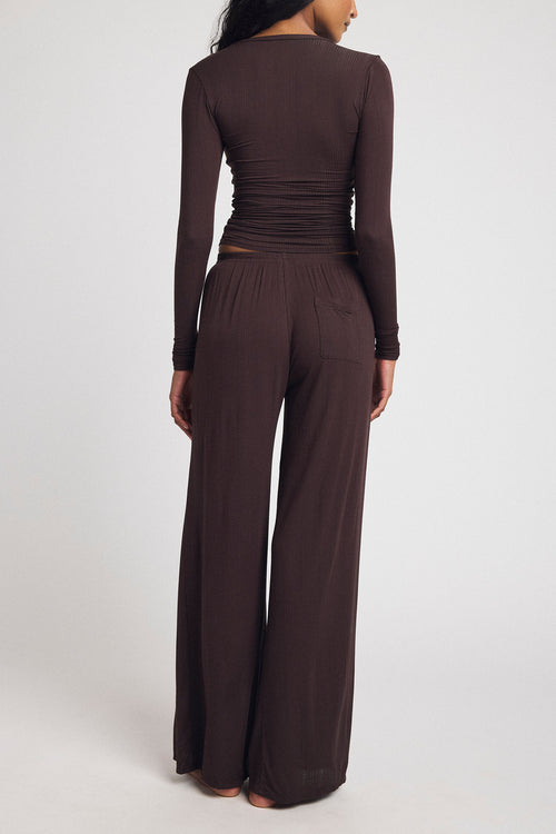 Dark brown wide-leg track pants with elastic waist and long back seam