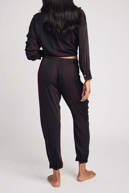 Dark striped jogger pants with elastic waist and cuffed ankle hem