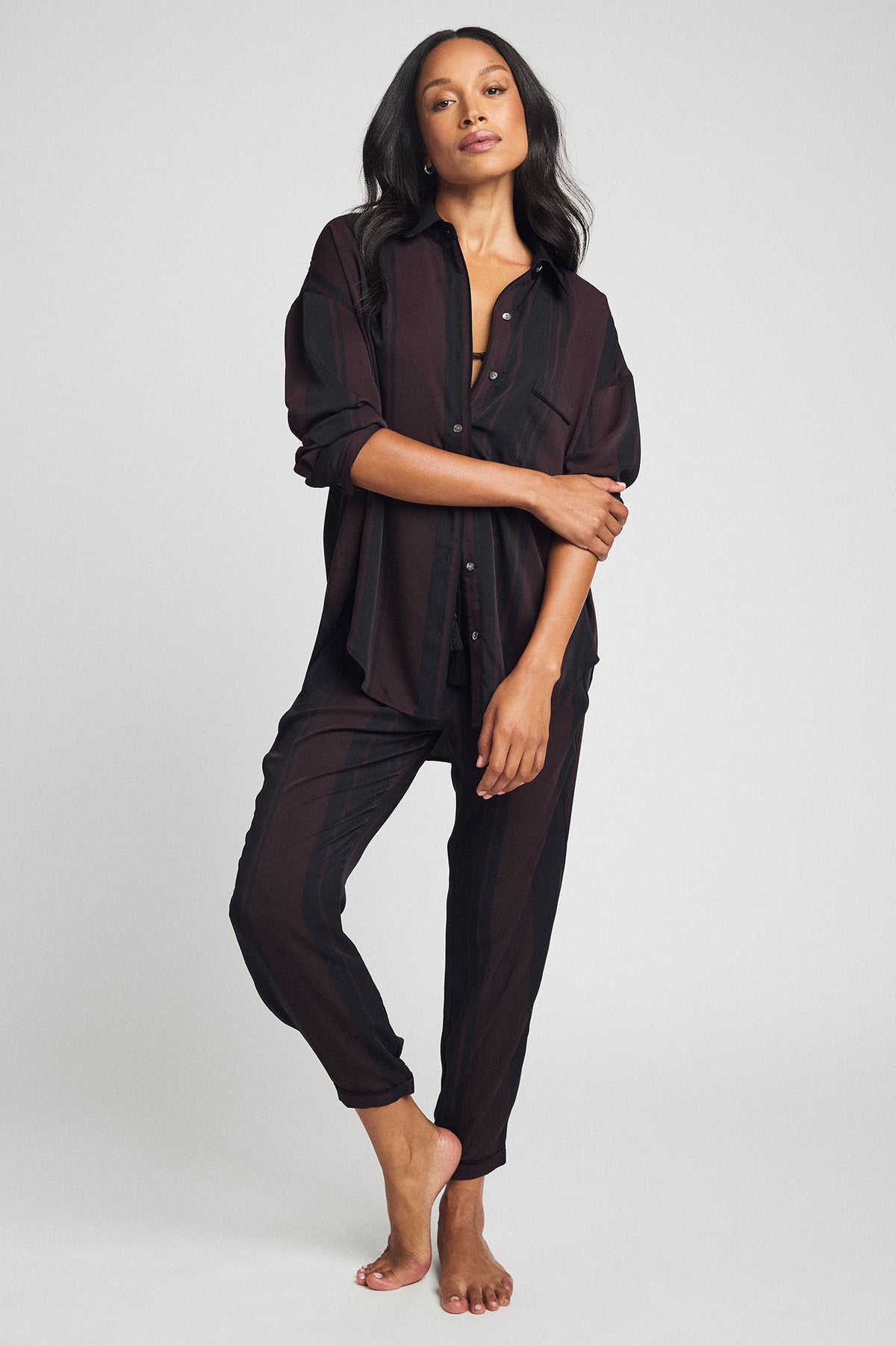 Dark striped jogger pants with drawstring waist and tapered legs