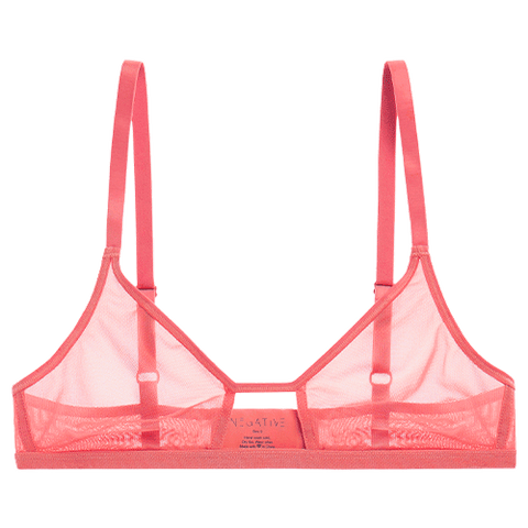Detail view of Sieve Cutout Bra in Coral for sizer